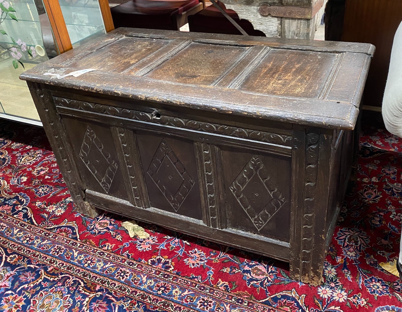 A 17th century carved panelled oak coffer, length 99cm, depth 50cm, height 58cm